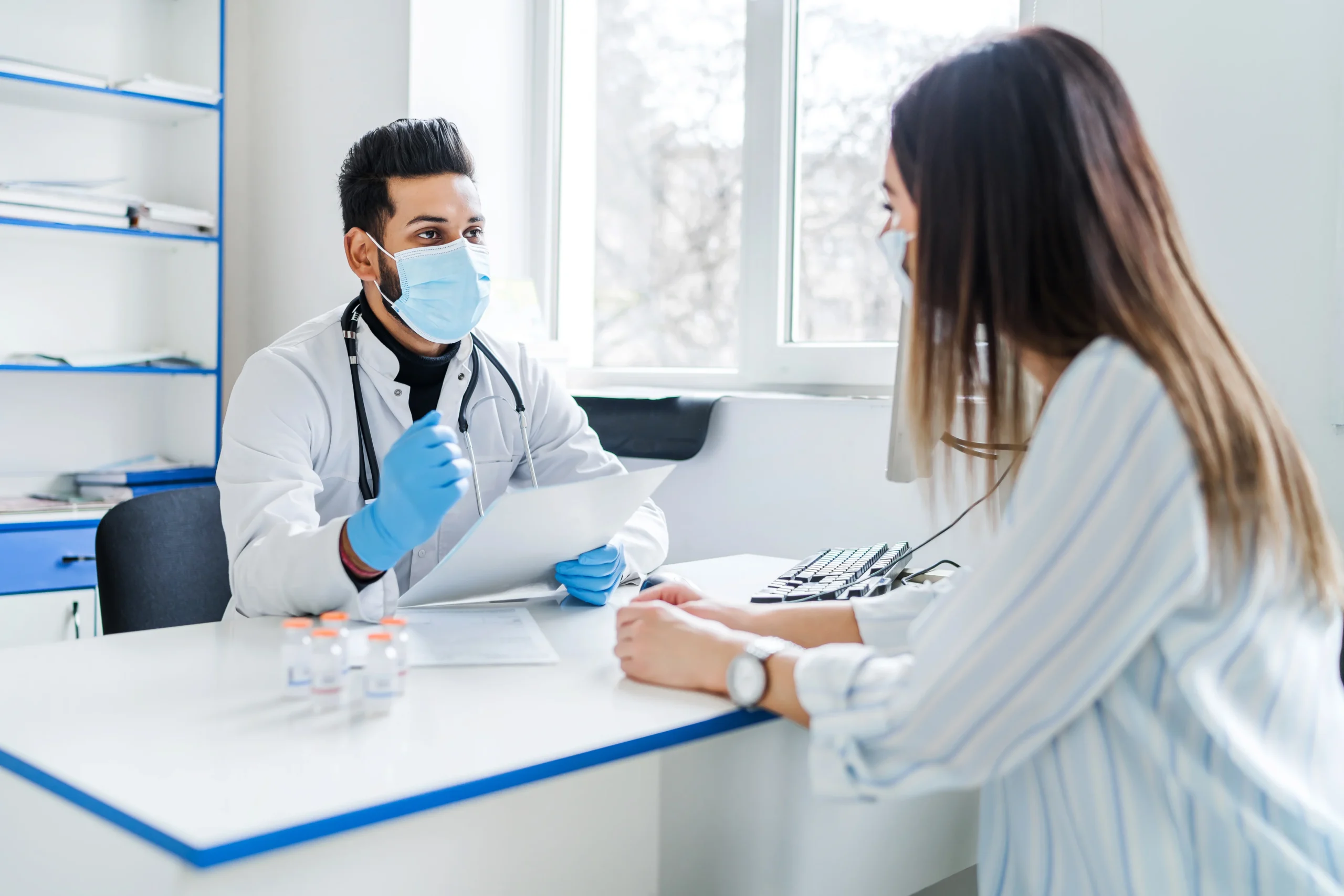 indian doctor receives patient tells him about results tests medicine health